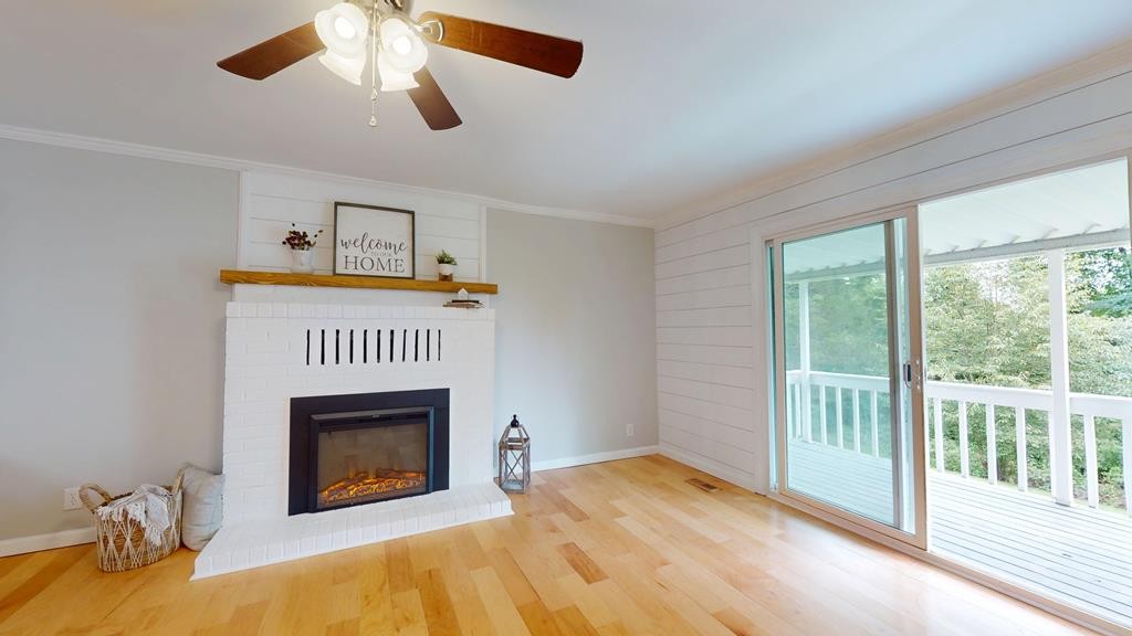 3766 Old Bridge Road Cookeville, TN 38506 - Photo 19 of 88 a view of an empty room with a fireplace and a window
