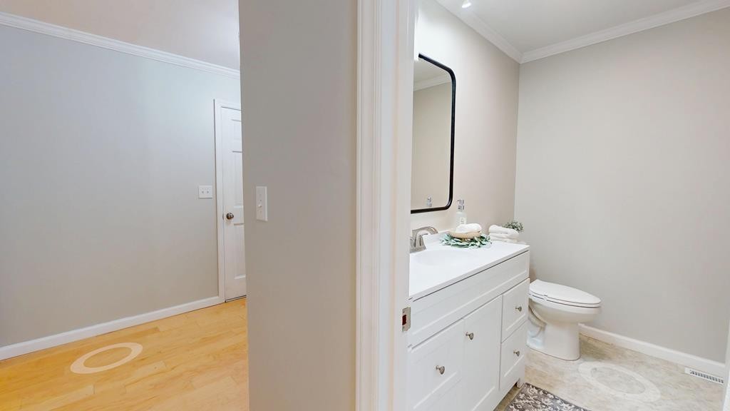 3766 Old Bridge Road Cookeville, TN 38506 - Photo 30 of 88 a bathroom with a sink a toilet and mirror
