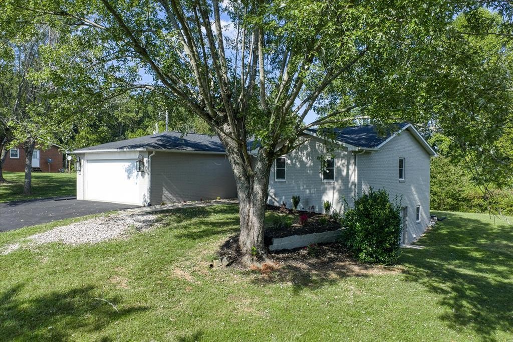 3766 Old Bridge Road Cookeville, TN 38506 - Photo 3 of 88 a view of a house with a yard and large tree