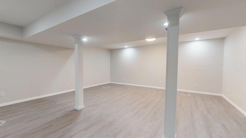 3766 Old Bridge Road Cookeville, TN 38506 - Photo 39 of 88 an empty room with wooden floor and windows