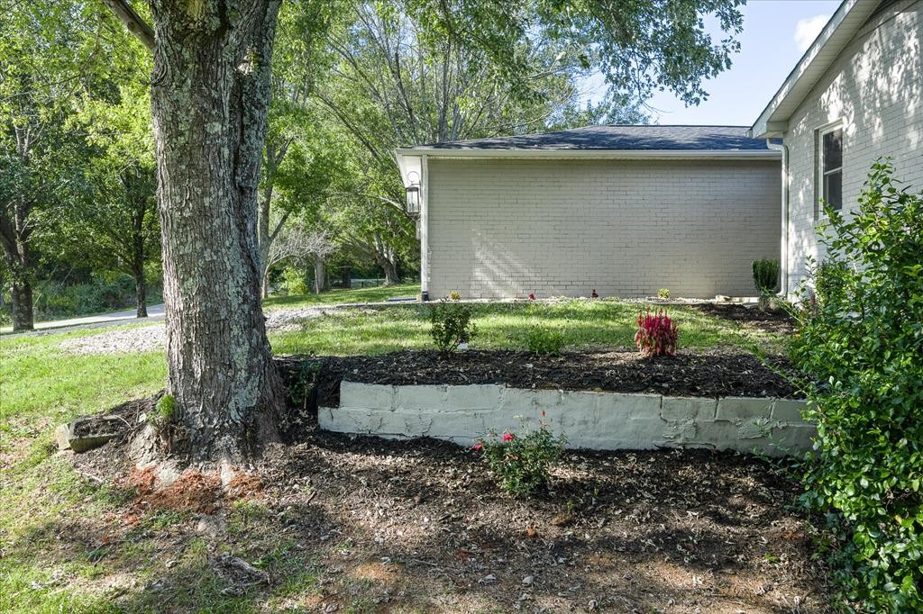 3766 Old Bridge Road Cookeville, TN 38506 - Photo 52 of 88 a backyard of a house with a yard and outdoor seating