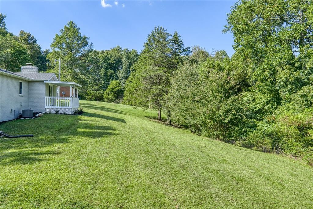 3766 Old Bridge Road Cookeville, TN 38506 - Photo 80 of 88 a view of a house with a backyard