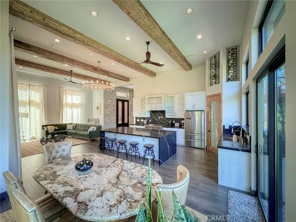 a large kitchen with a table and chairs