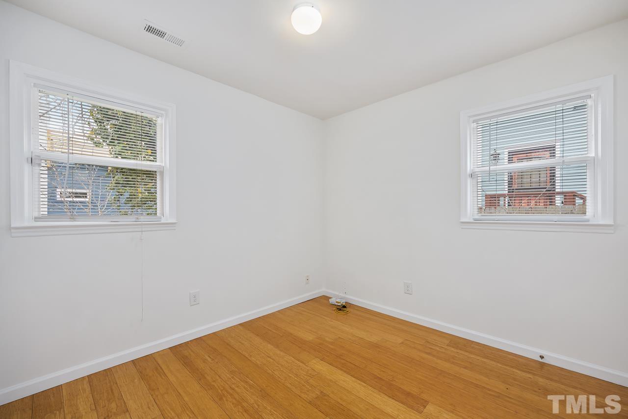 914 South Person Street Raleigh, NC 27601 - Photo 10 of 19 a view of empty room with wooden floor and fan