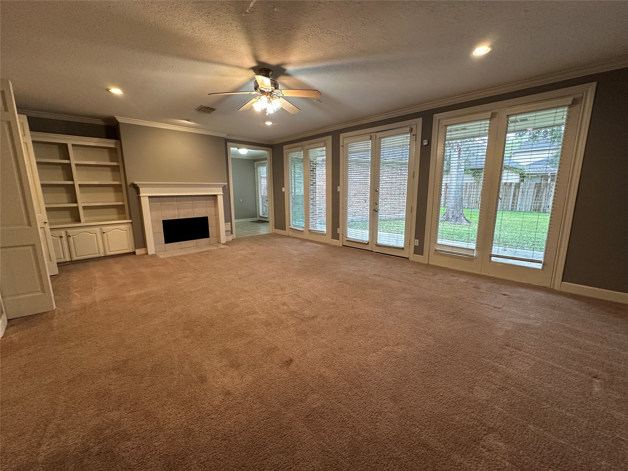7710 Post Bridge Road Spring, TX 77389 - Photo 11 of 38 a view of an empty room with chandelier fan and fire place