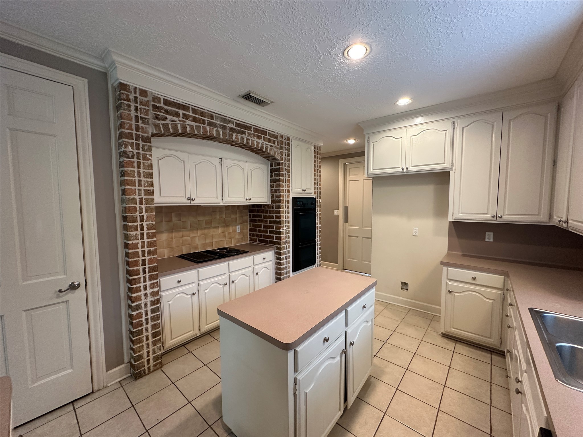 7710 Post Bridge Road Spring, TX 77389 - Photo 17 of 38 a kitchen with a cabinets and a stove top oven