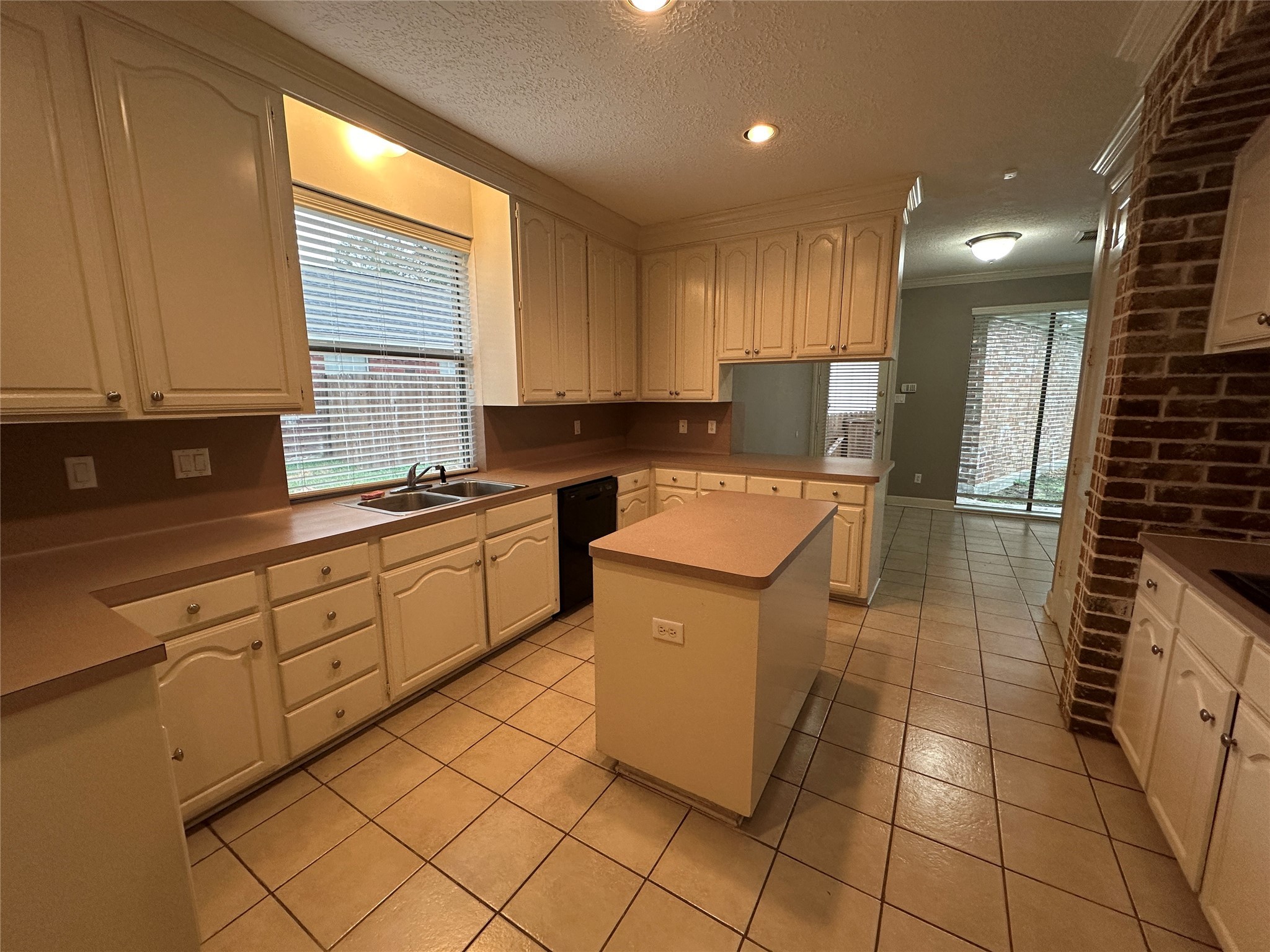 7710 Post Bridge Road Spring, TX 77389 - Photo 18 of 38 a kitchen with a sink a stove cabinets and a window