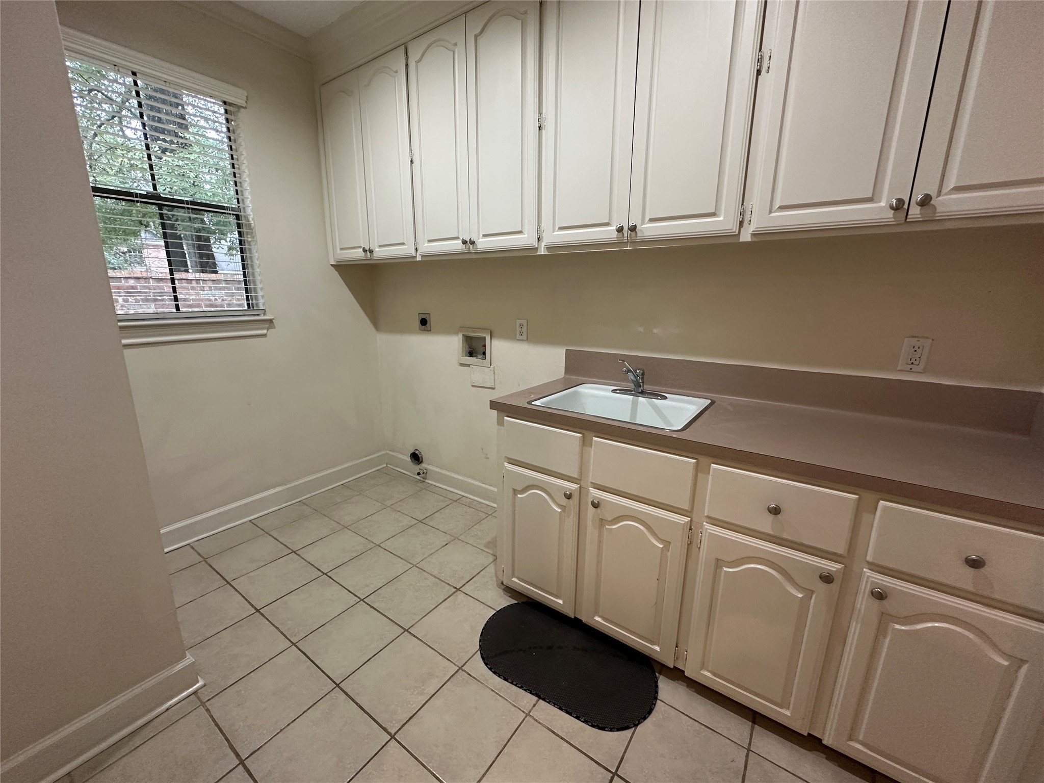 7710 Post Bridge Road Spring, TX 77389 - Photo 19 of 38 a kitchen with white cabinets and sink