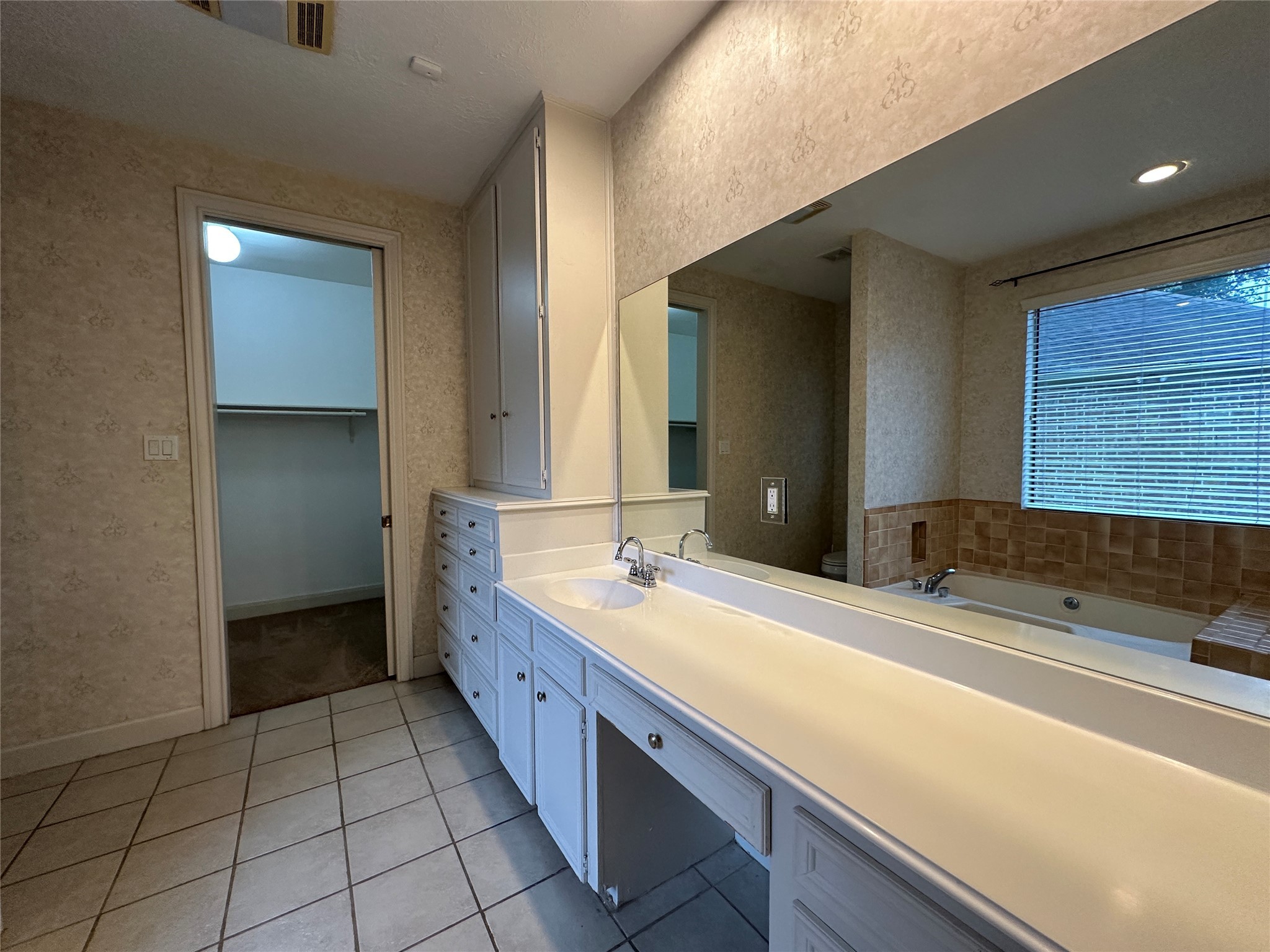 7710 Post Bridge Road Spring, TX 77389 - Photo 24 of 38 a bathroom with a double vanity sink and a mirror