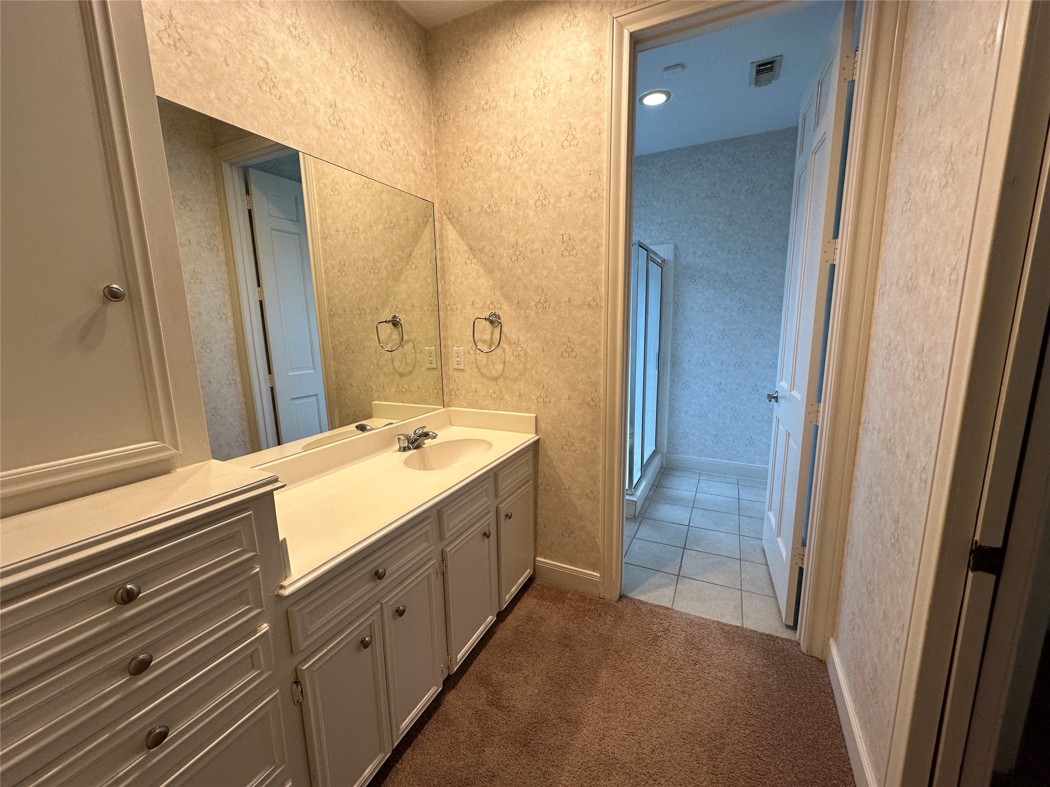 7710 Post Bridge Road Spring, TX 77389 - Photo 26 of 38 a bathroom with a double vanity sink and mirror with shower