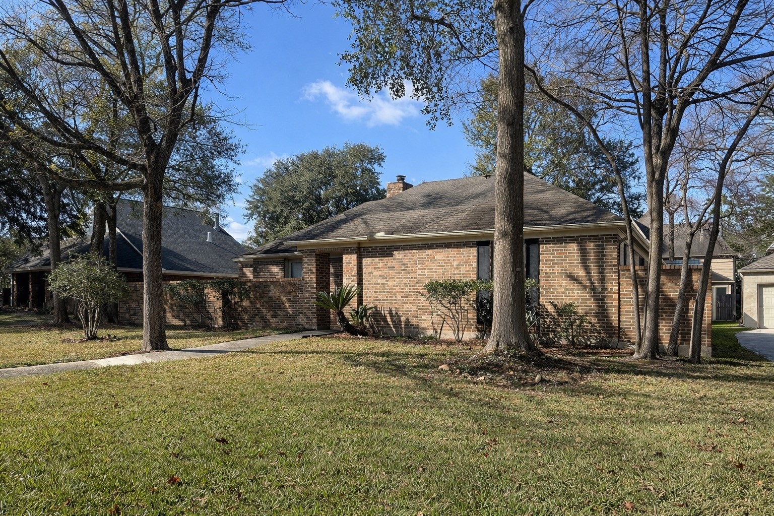 7710 Post Bridge Road Spring, TX 77389 - Photo 3 of 38 a view of a house with a yard covered with snow and trees