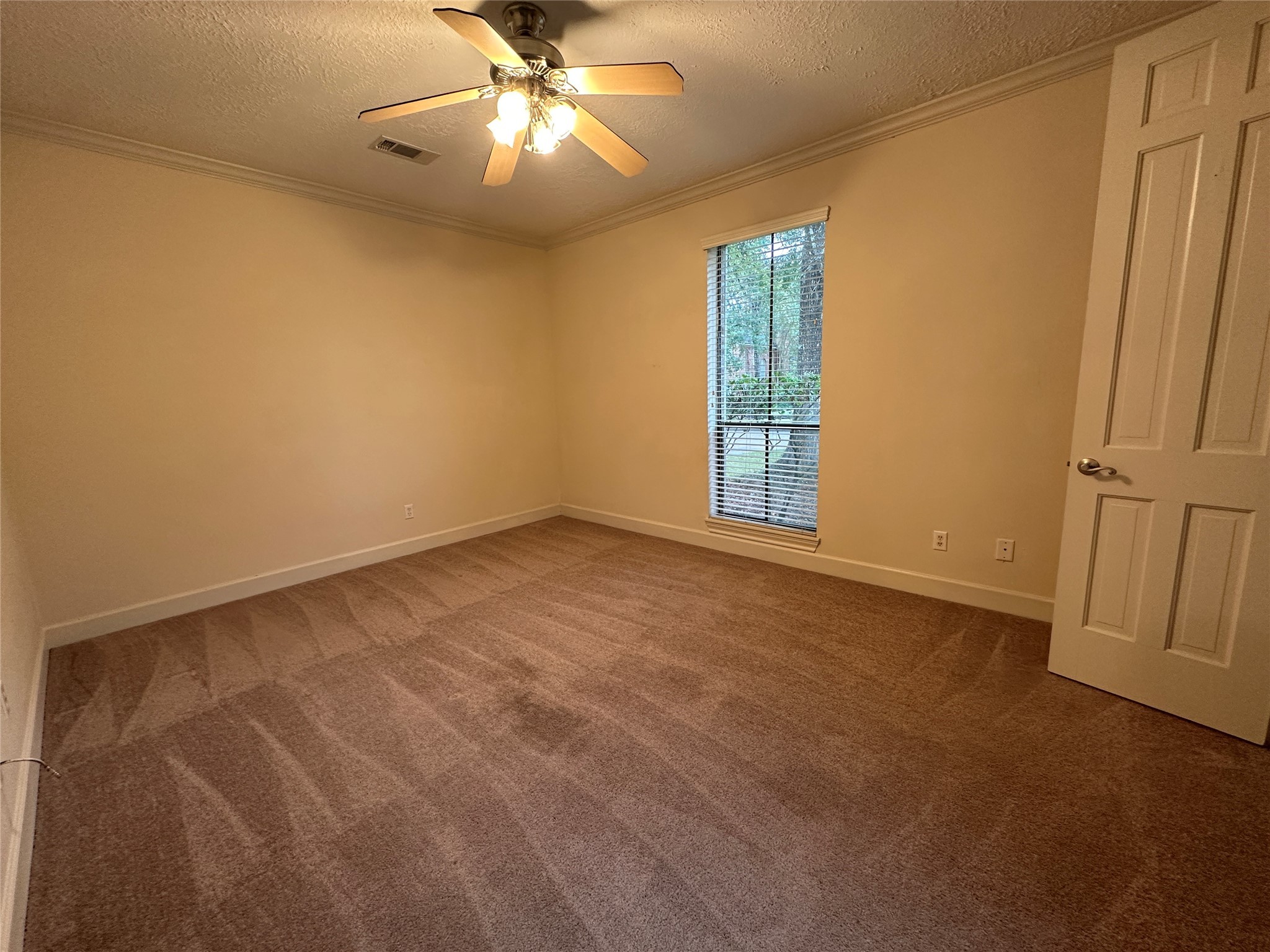 7710 Post Bridge Road Spring, TX 77389 - Photo 32 of 38 an empty room with windows and fan