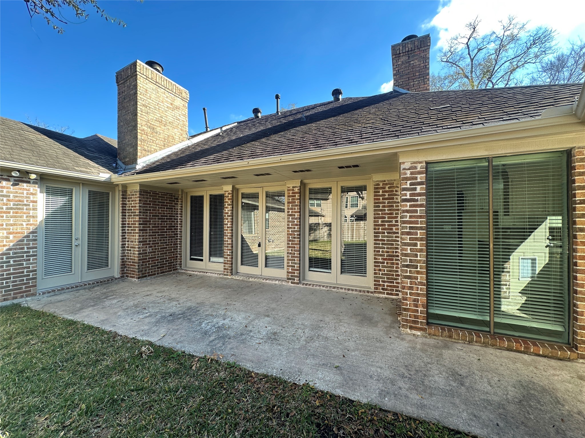 7710 Post Bridge Road Spring, TX 77389 - Photo 36 of 38 a view of a house with large windows and a yard
