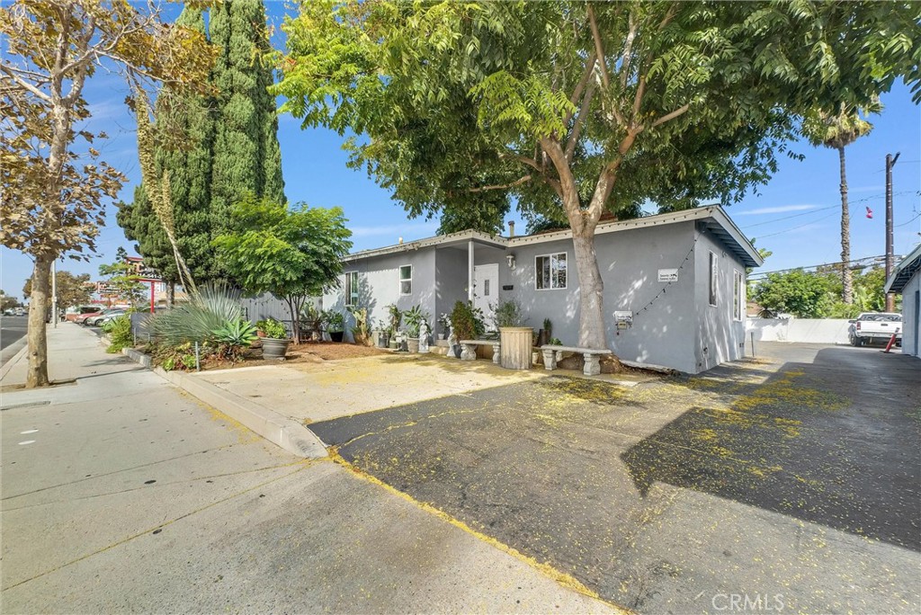 1819 West 17th Street Santa Ana, CA 92706 - Photo 8 of 13 a front view of a house with a yard and garage