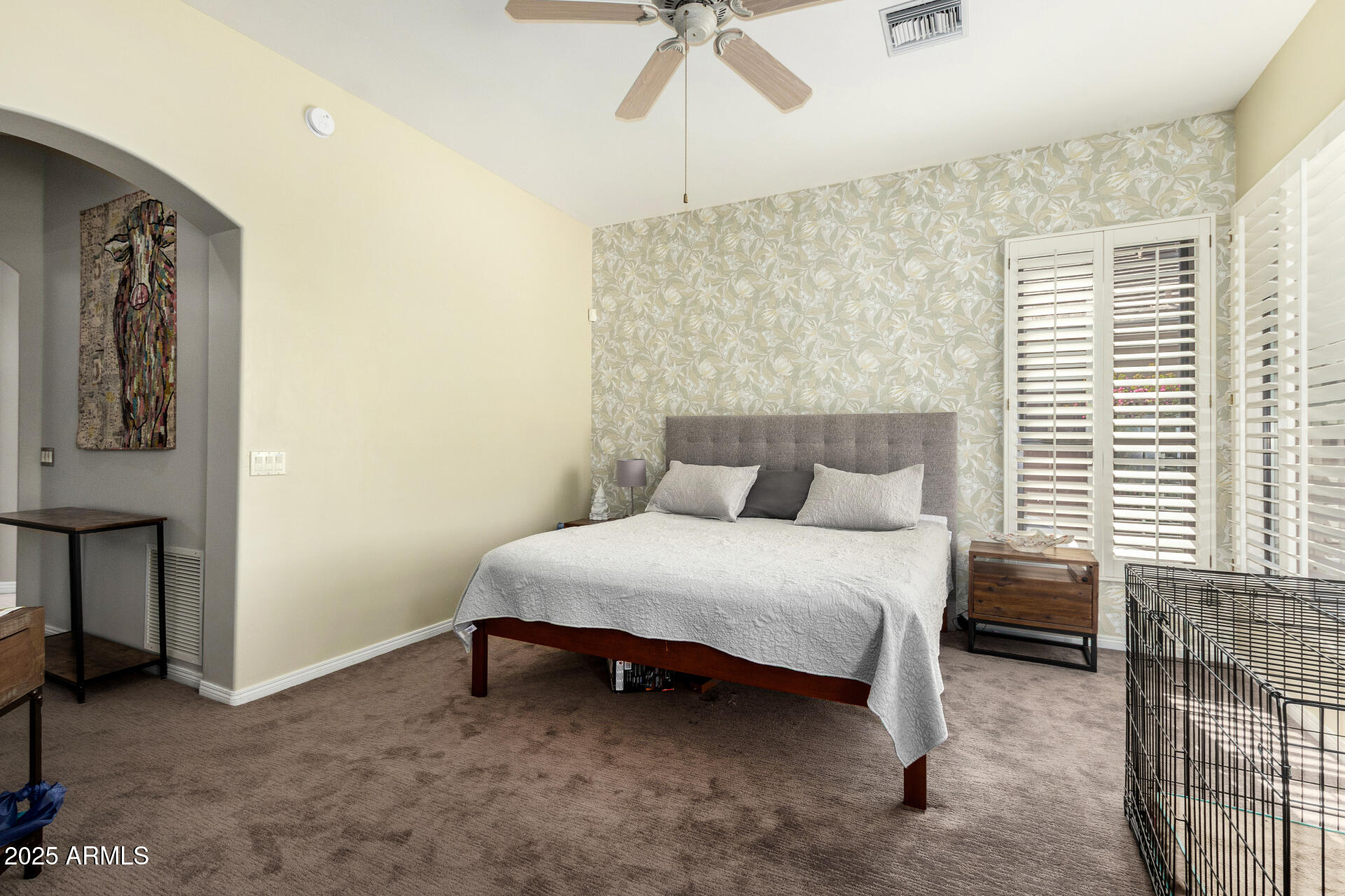 6645 East Redmont Drive, Unit 13 Mesa, AZ 85215 - Photo 13 of 41 a bedroom with a bed and a chandelier