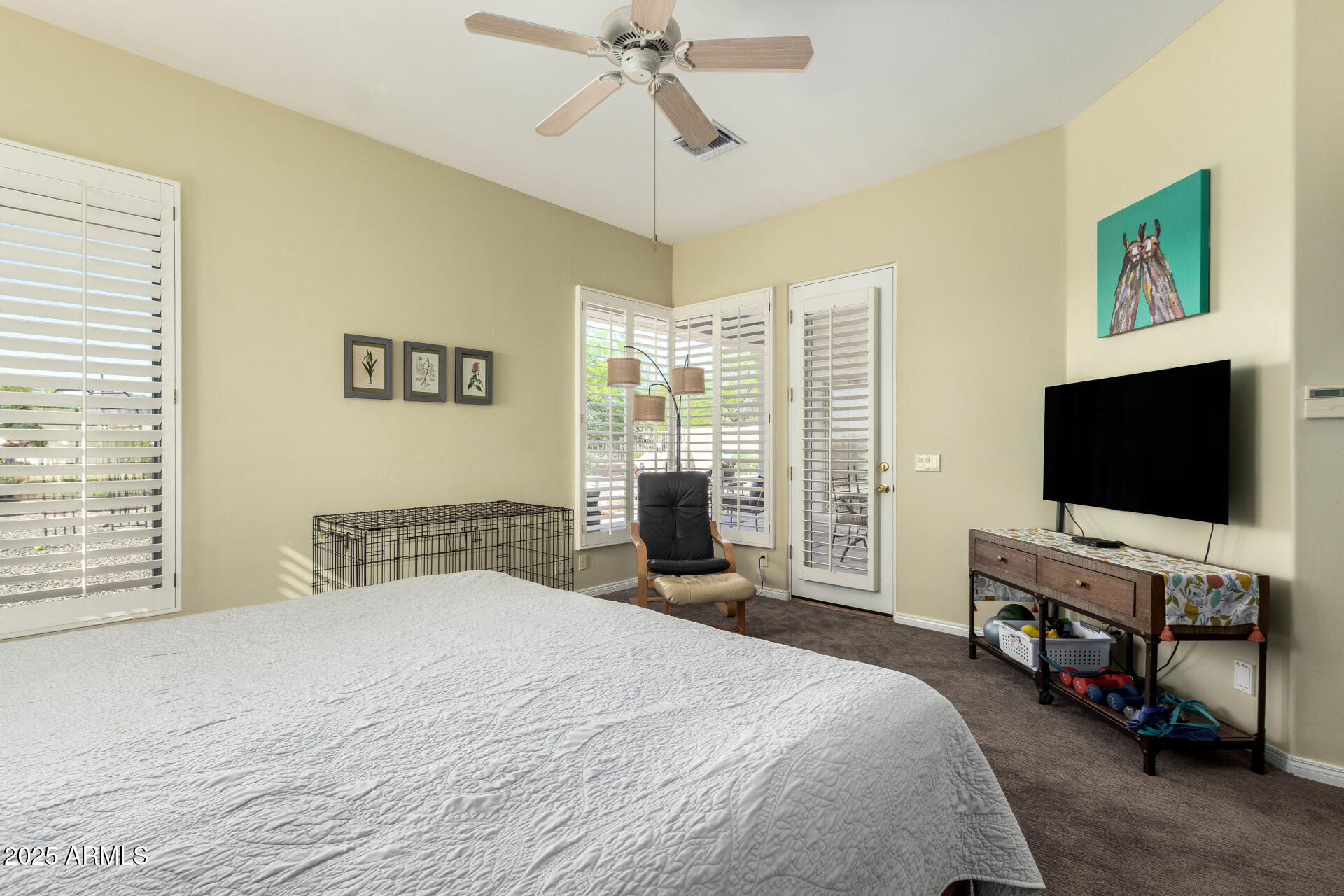 6645 East Redmont Drive, Unit 13 Mesa, AZ 85215 - Photo 14 of 41 a bedroom with a bed and a flat screen tv