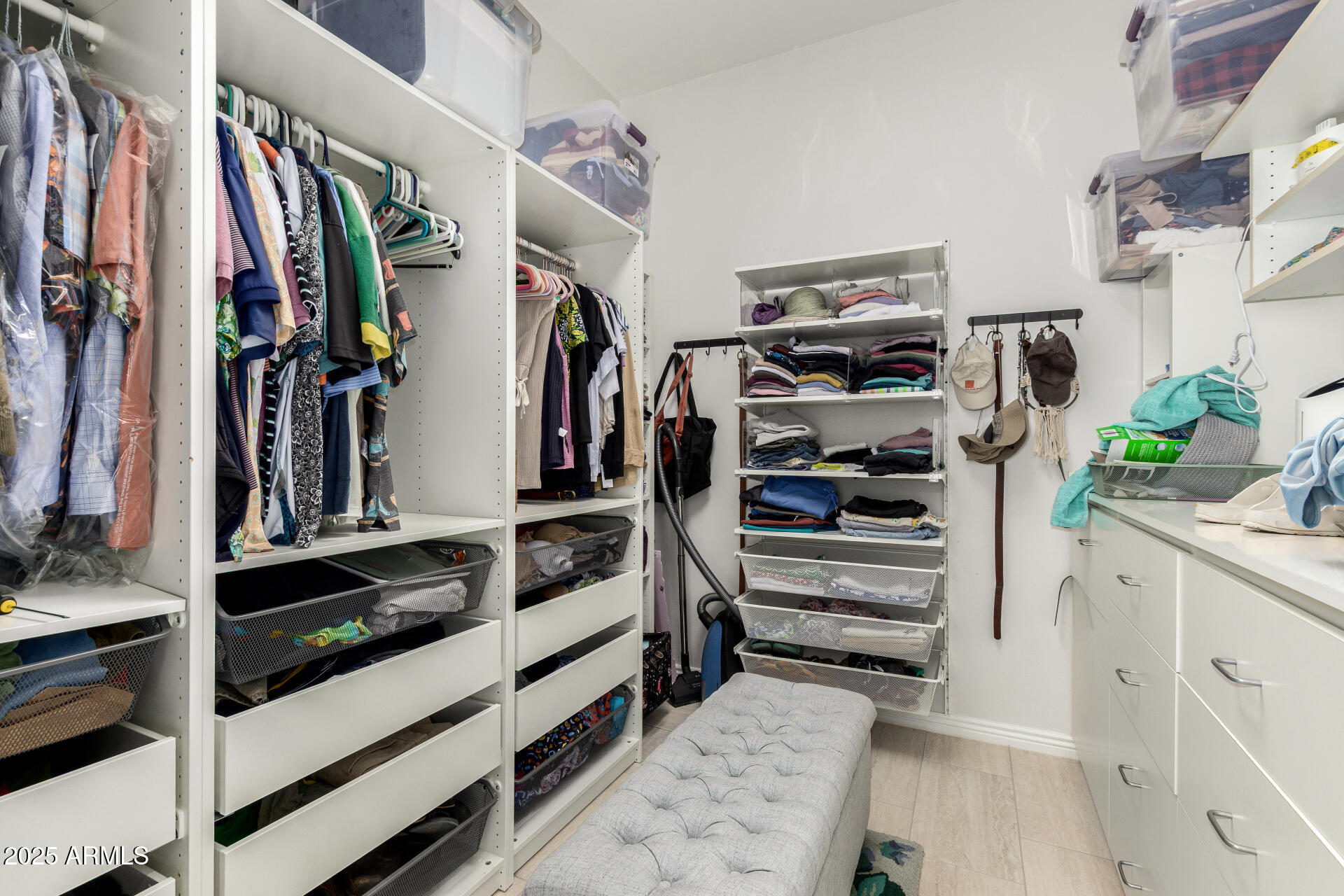 6645 East Redmont Drive, Unit 13 Mesa, AZ 85215 - Photo 17 of 41 a view of walk in closet with clothes and shoes