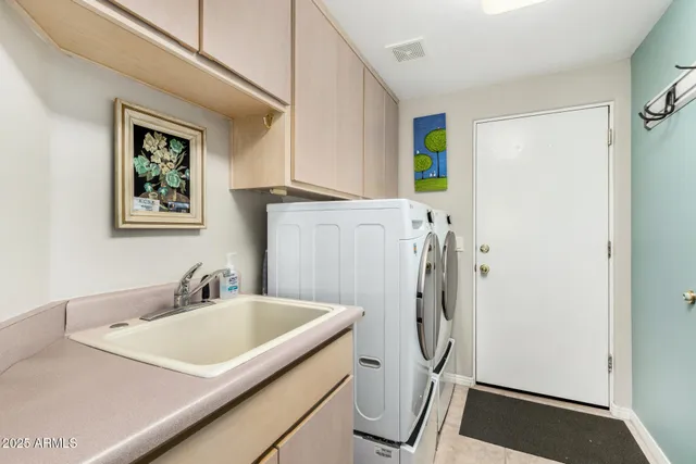 a bathroom with a granite countertop sink a mirror and a shower