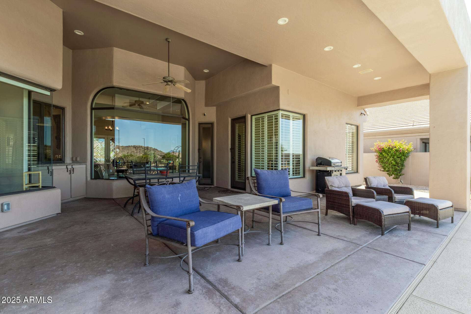 6645 East Redmont Drive, Unit 13 Mesa, AZ 85215 - Photo 26 of 41 a living room with furniture and a large window