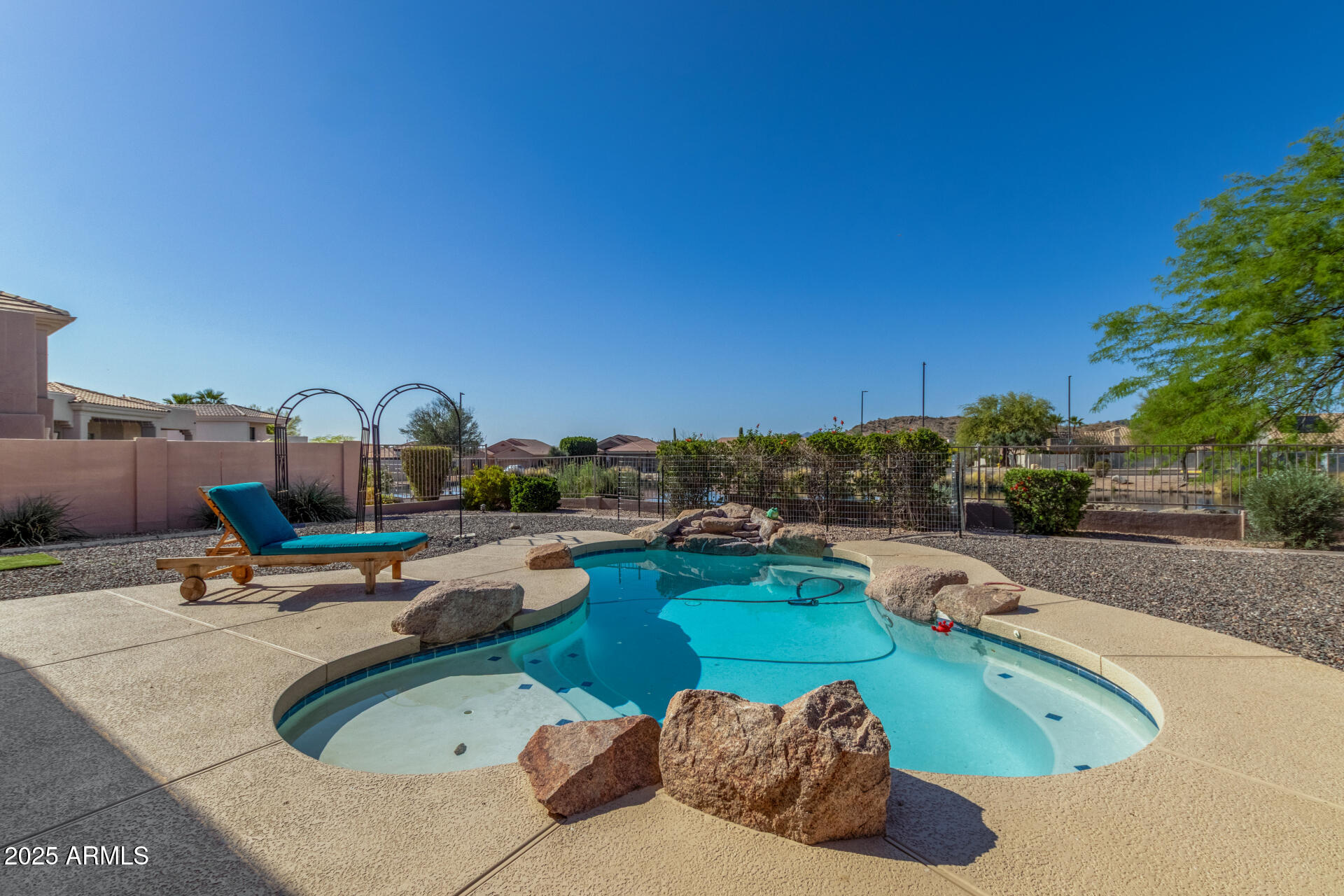 6645 East Redmont Drive, Unit 13 Mesa, AZ 85215 - Photo 27 of 41 a swimming pool with outdoor seating and barbeque