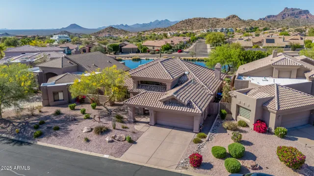 an aerial view of a house with outdoor space
