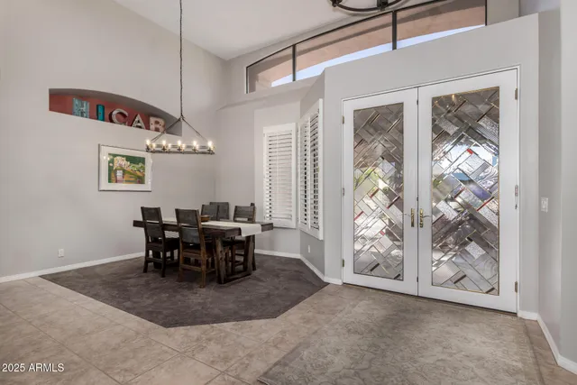 a view of a dining room with furniture and chandelier