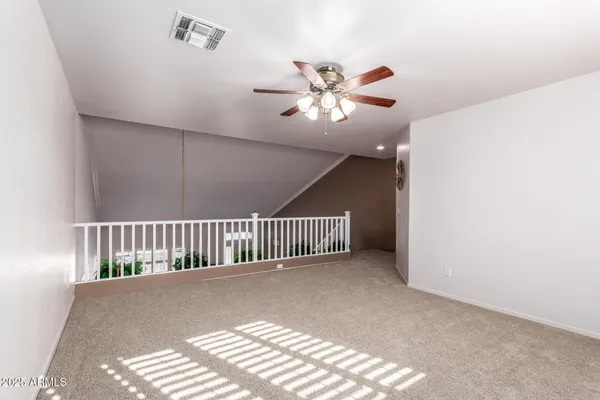 a view of entryway and hall with a chandelier