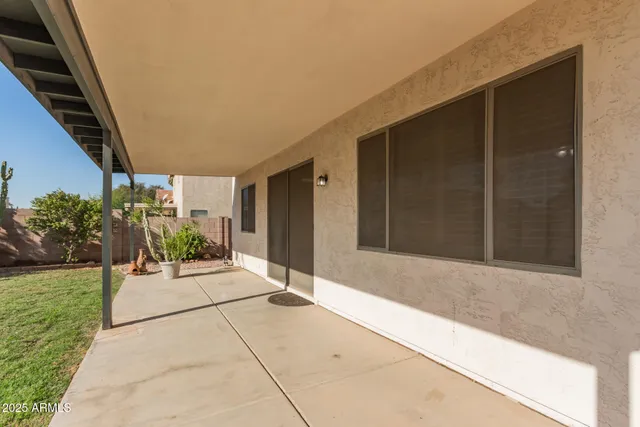a porch with seating space and yard