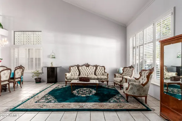 a living room with furniture and a rug