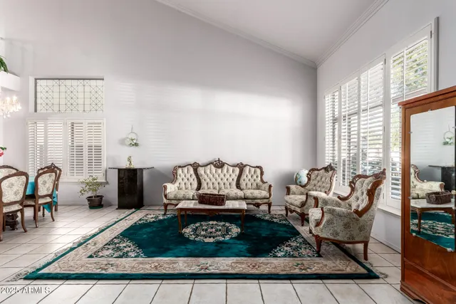 a living room with furniture and a rug