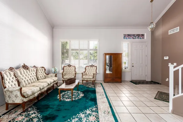 a living room with furniture and a window