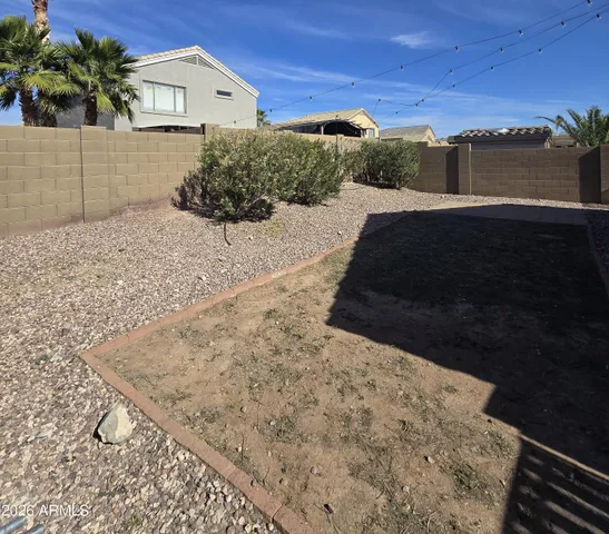 a view of potted plants in front of house