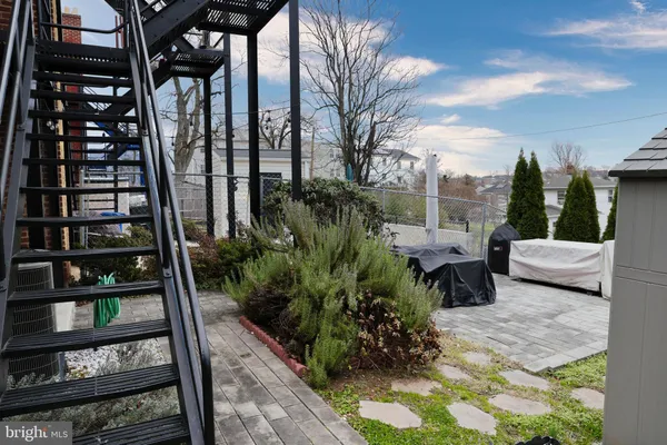 a view of a chairs and tables in the patio