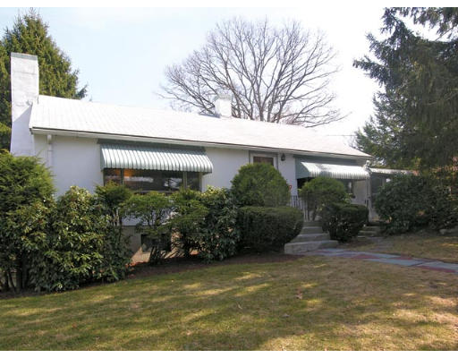 66 Oakmont Road Newton, MA 02459 - Photo 1 of 1 a front view of a house with garden