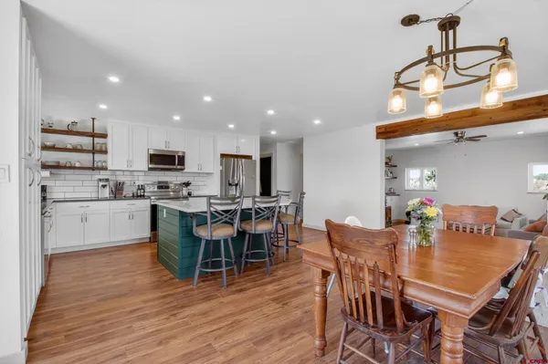 a view of kitchen with cabinets and wooden floor