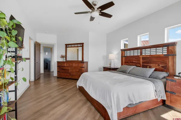 a bedroom with a bed and a dresser