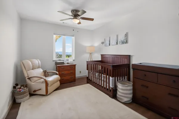 a bedroom with furniture and a window