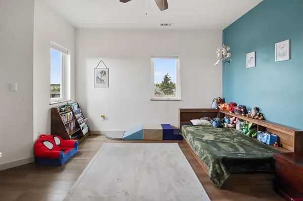 a bedroom with bed and furniture