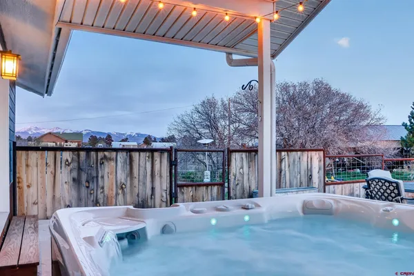 a view of balcony with wooden floor and outdoor seating