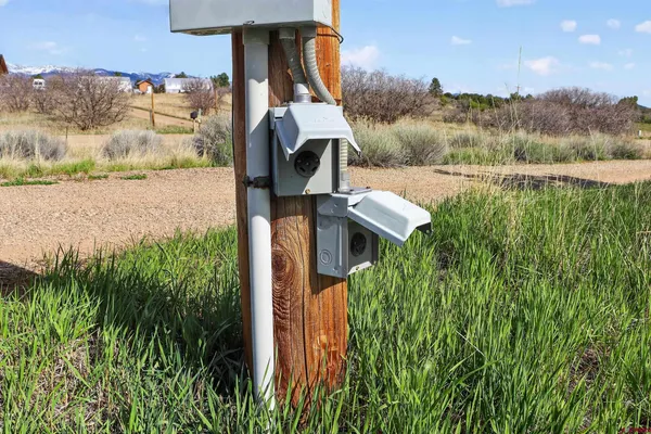 a front view of a house with a yard table and chairs