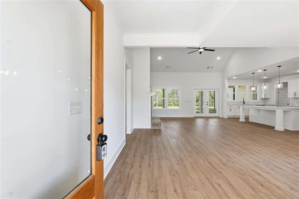 11691 Hazelbrand Road Northeast Covington, GA 30014 - Photo 6 of 53 a view of a hallway with wooden floor