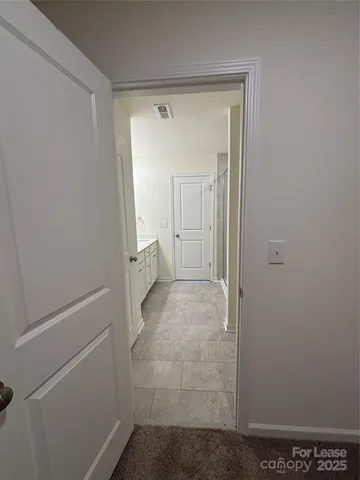 a bathroom with a double vanity sink a mirror and a bathtub