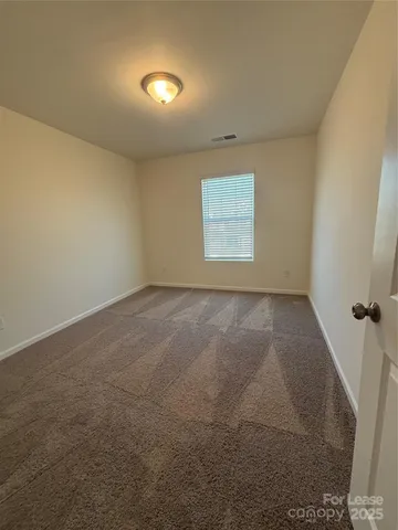 a view of a big room with closet and mirror