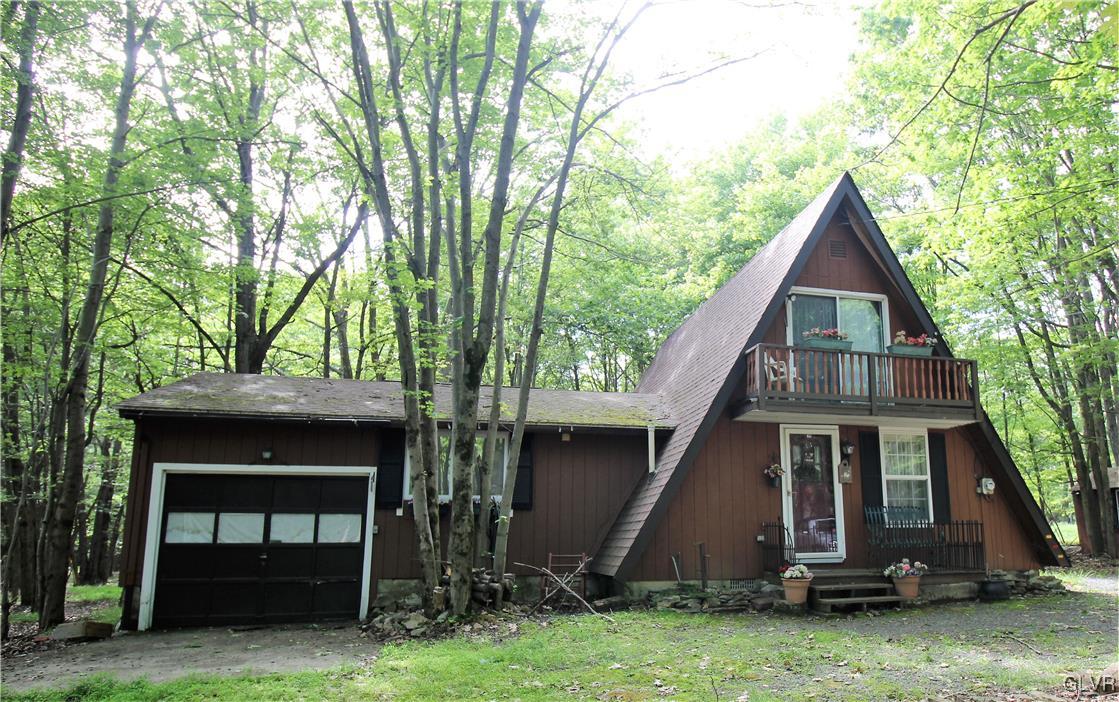 112 Fern Ridge Road Blakeslee, PA 18610 - Photo 1 of 18 a front view of a house with a yard
