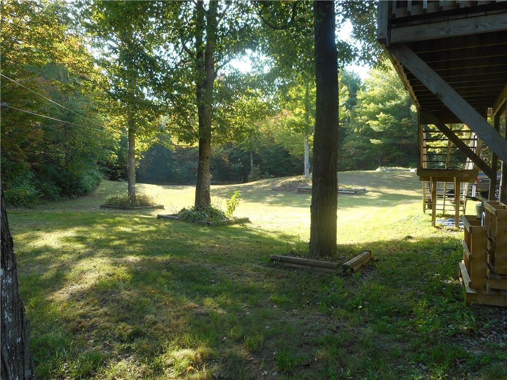 67 Maple Grove South China, ME 04358 - Photo 9 of 33 Backyard with raised garden beds.
