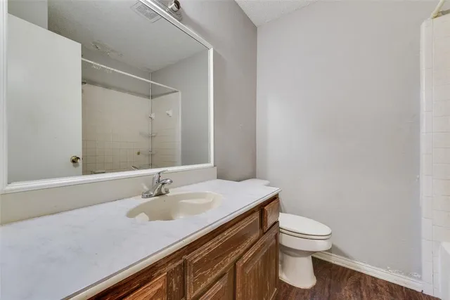 a bathroom with a sink toilet and vanity