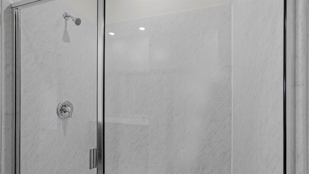 1627 Mantle Road Crandall, TX 75114 - Photo 19 of 40 Shower enclosure featuring clear glass panels, chrome hardware, and light-toned wall surround