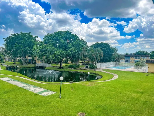a view of a lake with a yard