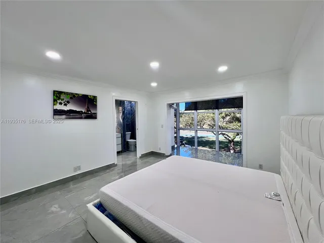 a view of a livingroom with furniture and a flat screen tv