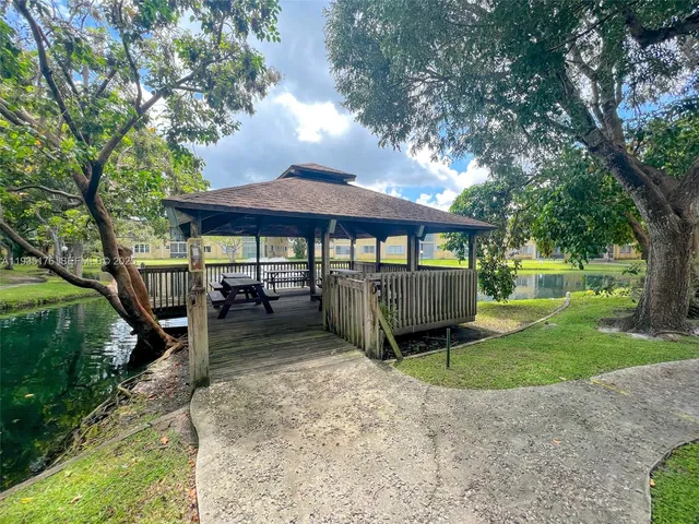 a view of a house with a yard porch and sitting area